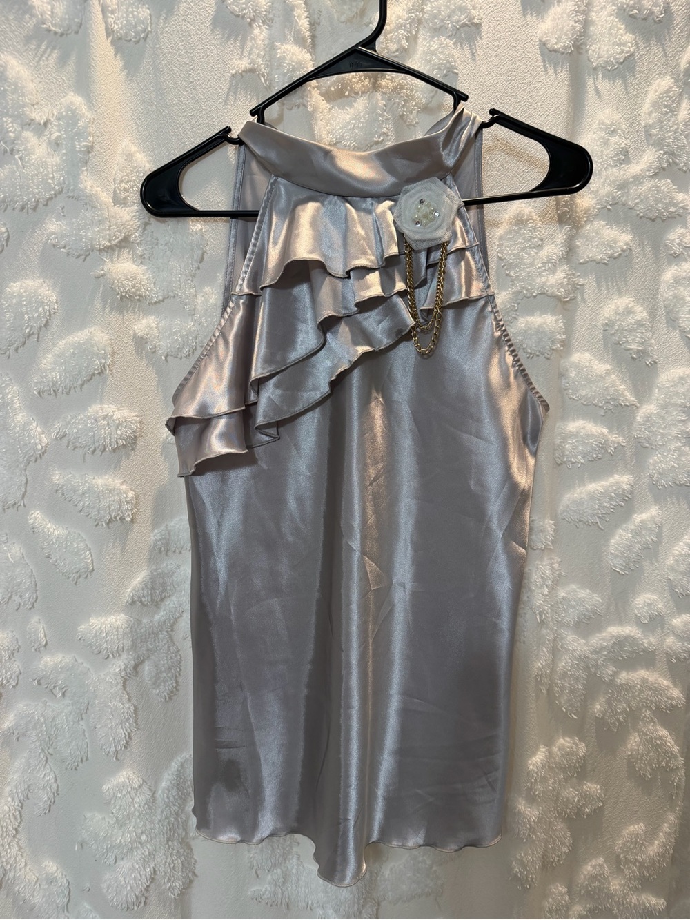 IZ Byer Silver satin top with ruffles and a bow detail